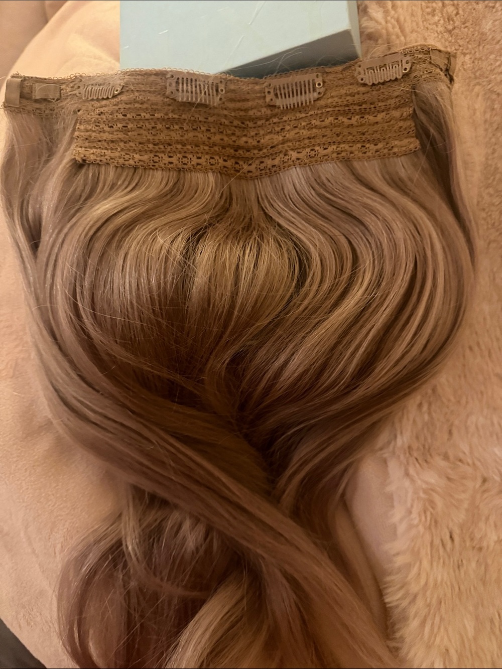 Luxy hair halo extensions in the color natural dimensional blonde 16 inches